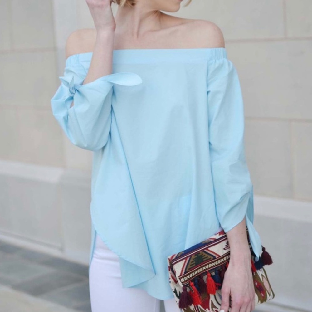 Light blue off the shoulder top with tie sleeve